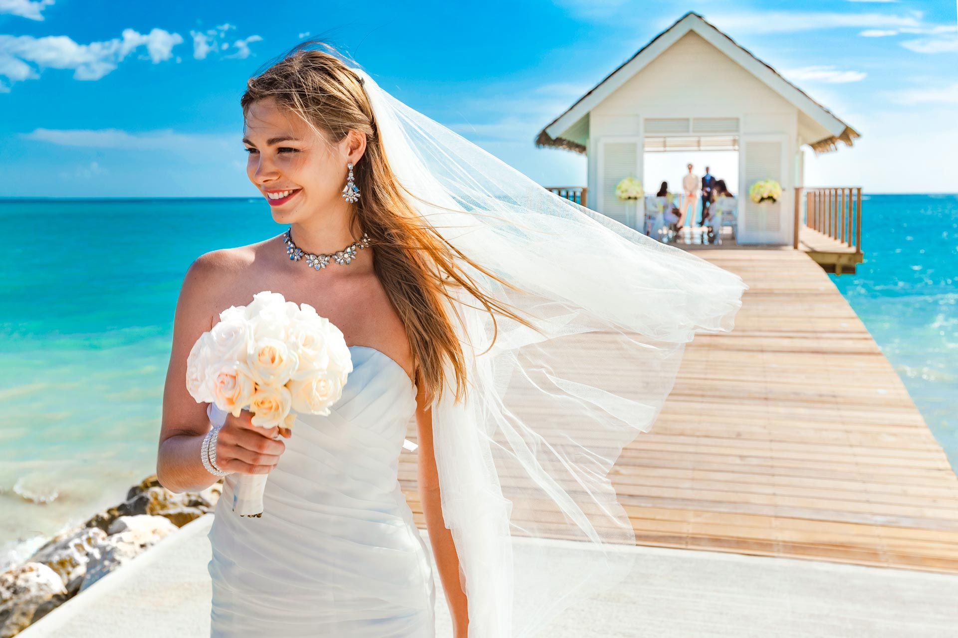 Bride on beach chapel dock