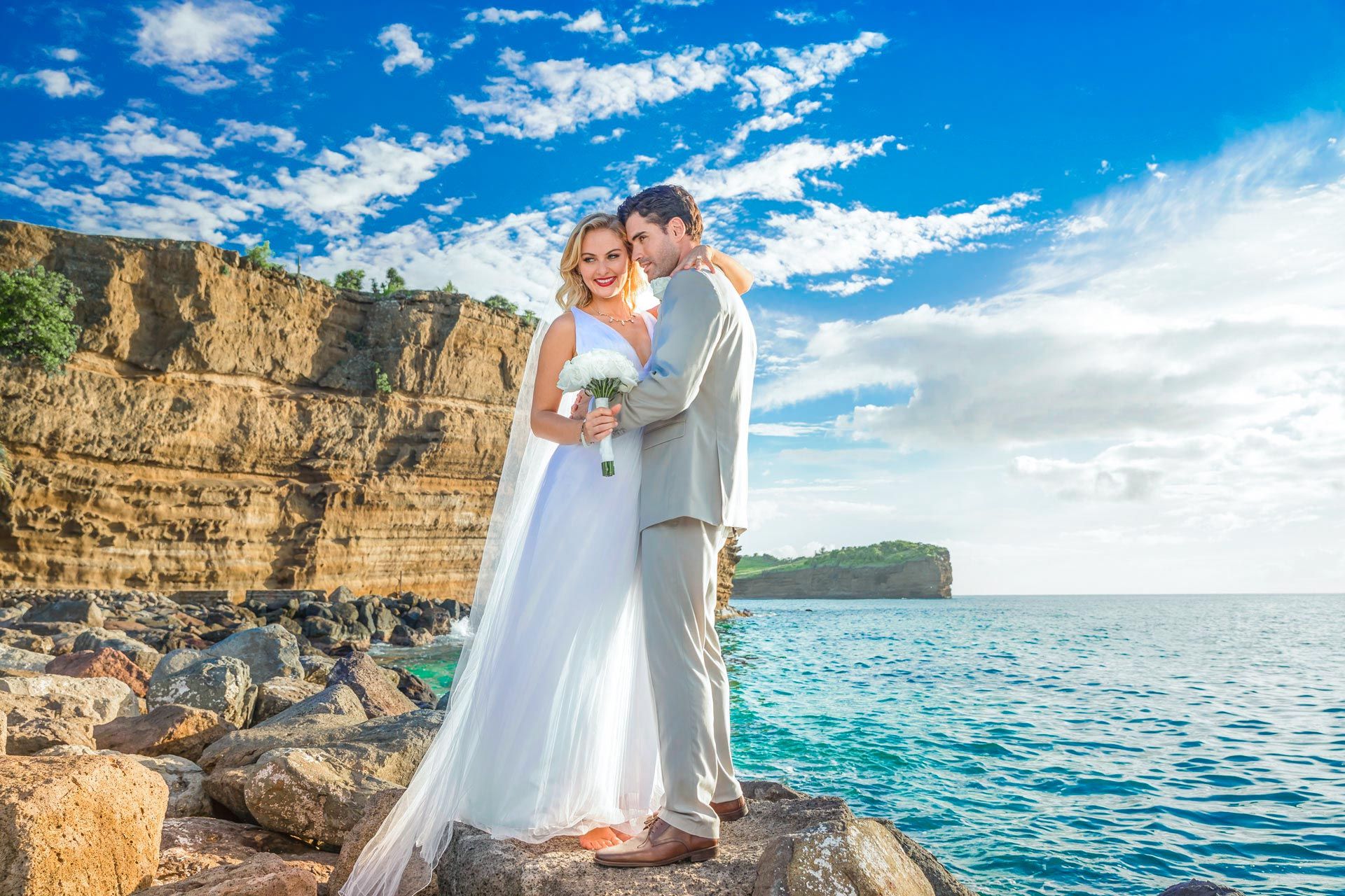 wedding couple on ocean rocks
