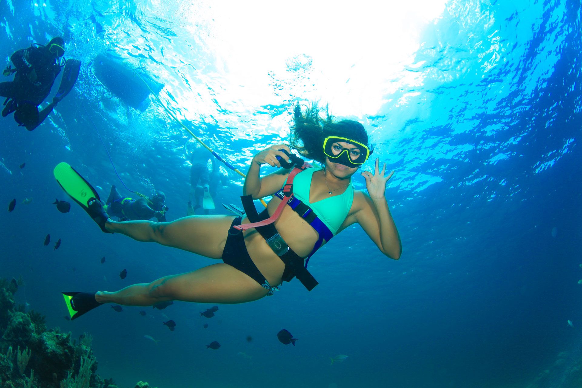 Female diver giving OK signal