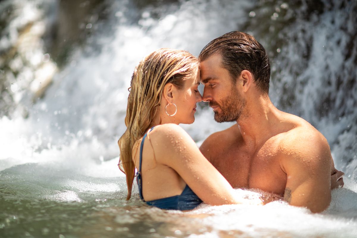 couple embracing in the water at dunns river falls