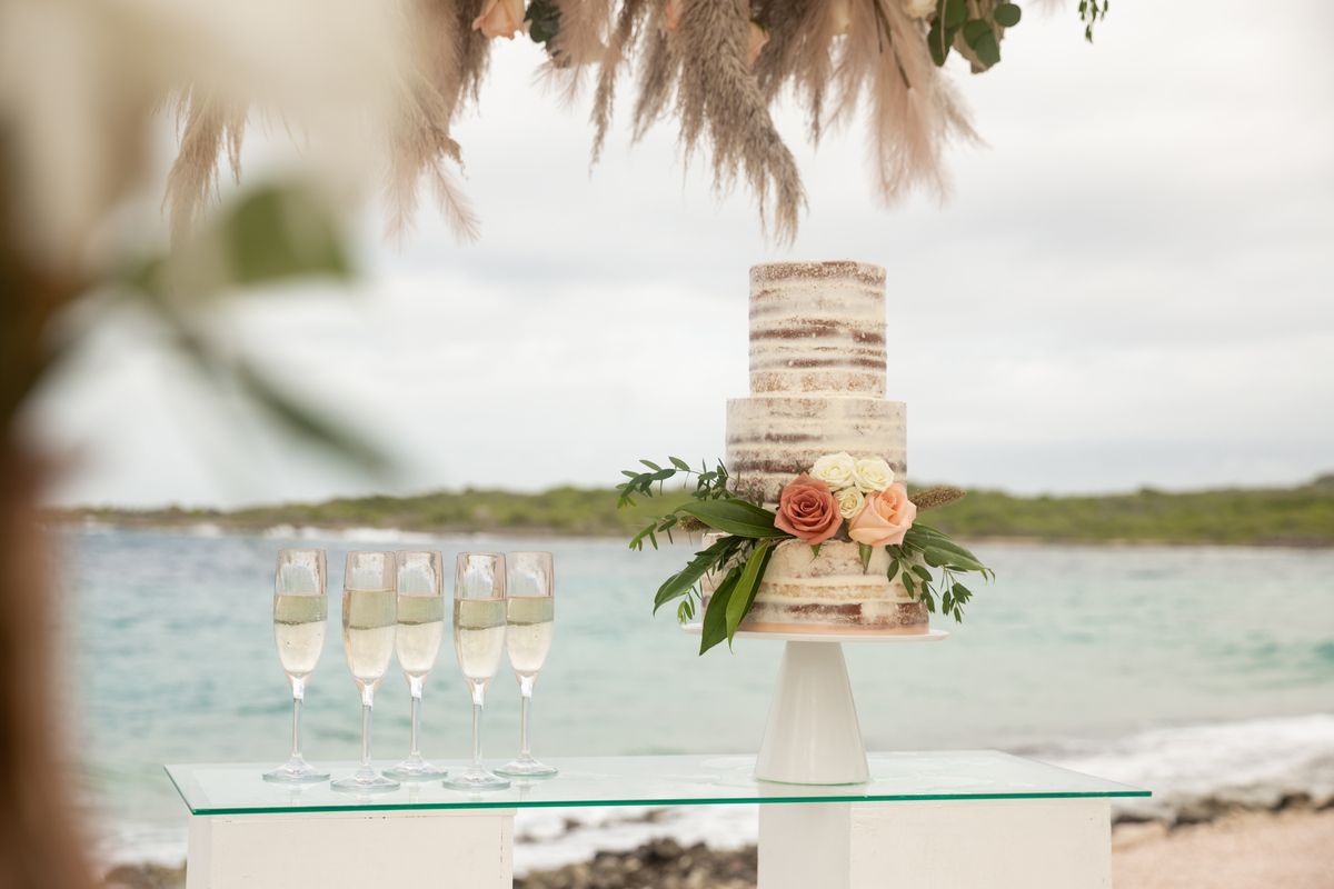 tiered wedding cake on the beach