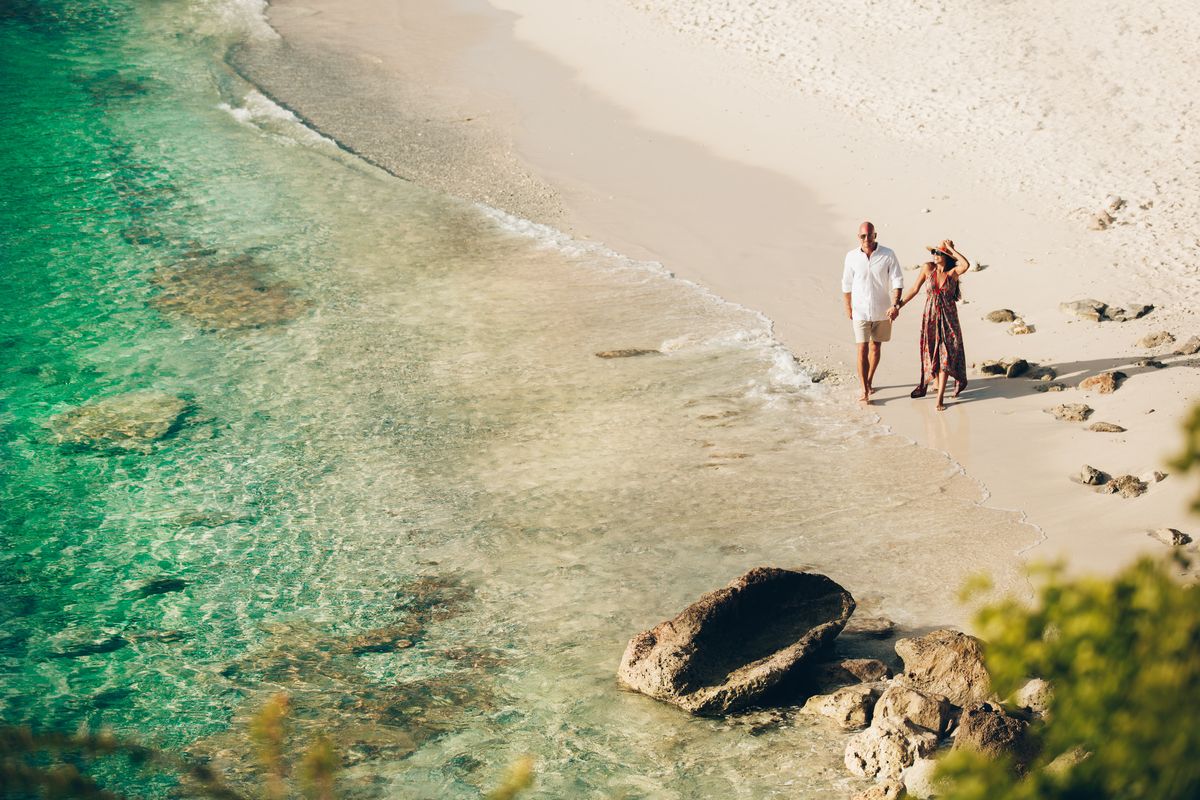 couple strolling the beach in curacao