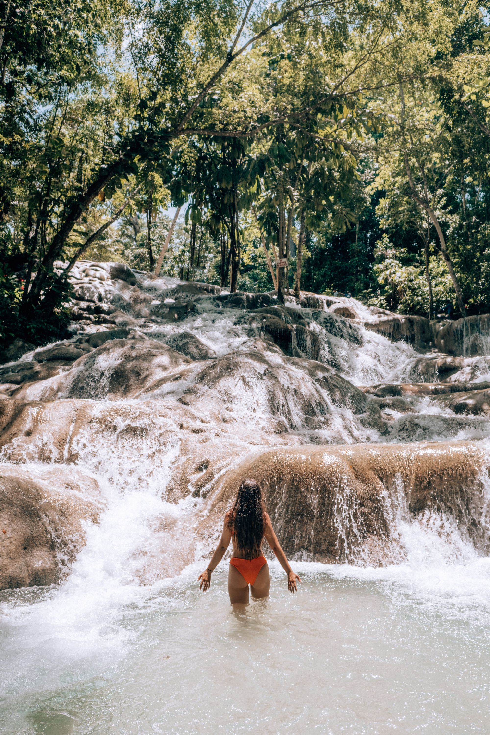 woman at dunns river falls in jamaica
