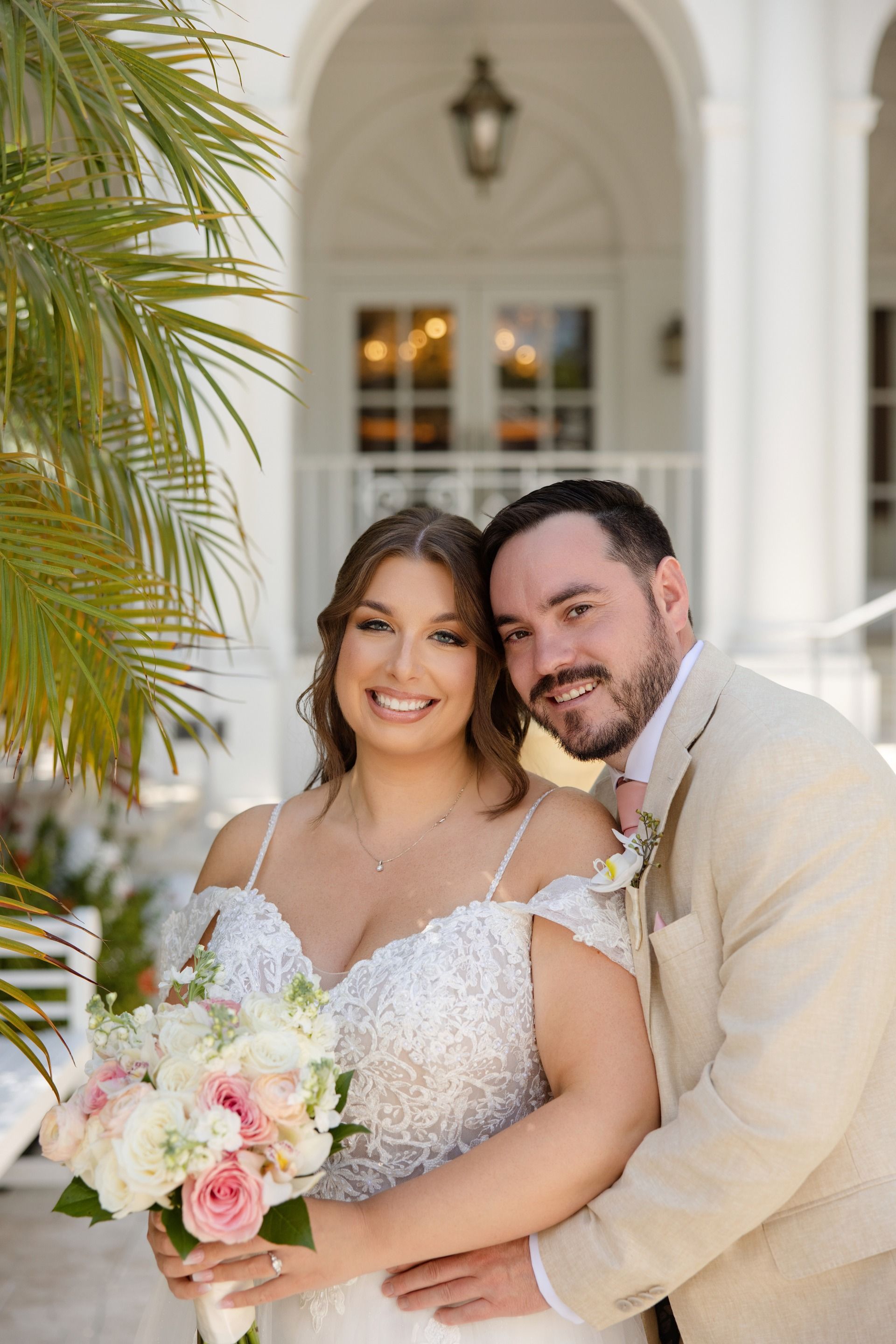 brie-matt-posed-in-front-of-white-colonial-style-building