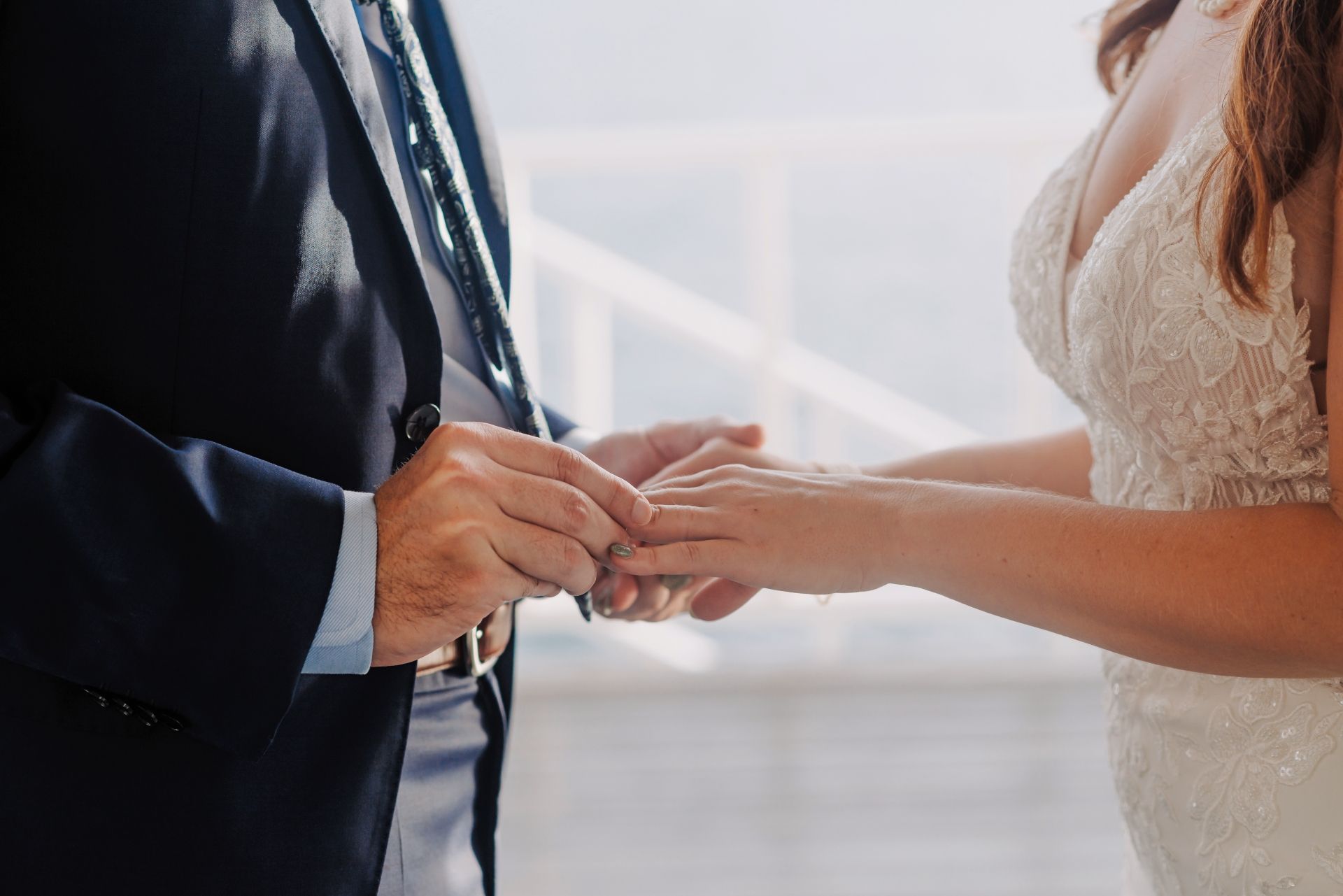 Bride and groom exchanging wedding rings during a destination ceremony