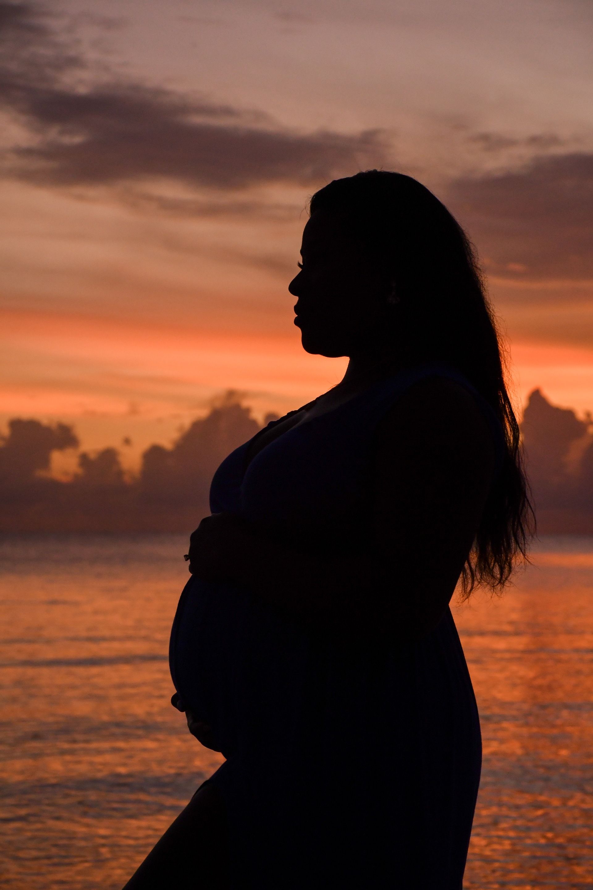 Stephanie glowing at sunset during her unforgettable babymoon at Sandals Jamaica