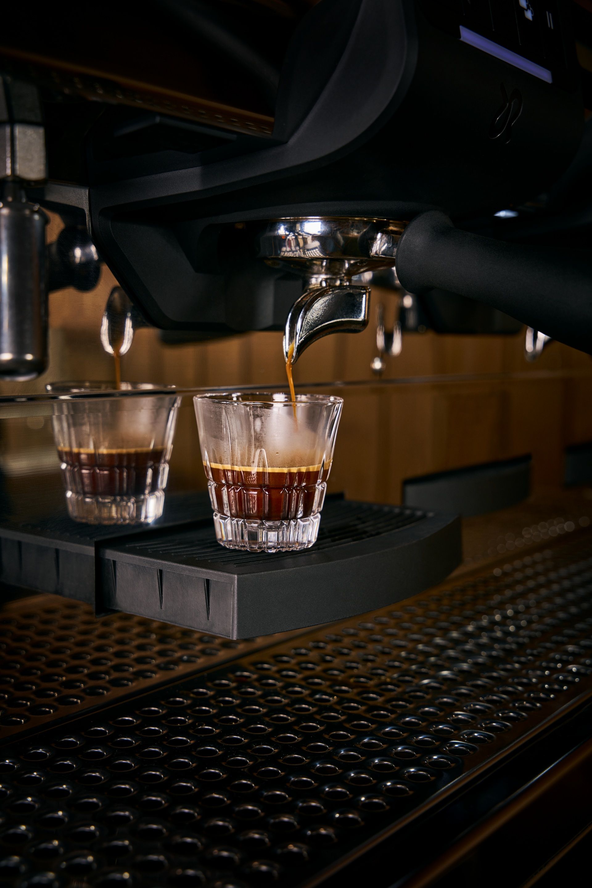 Espresso shots being pulled from a commercial coffee machine at BLŪM cafe at Sandals