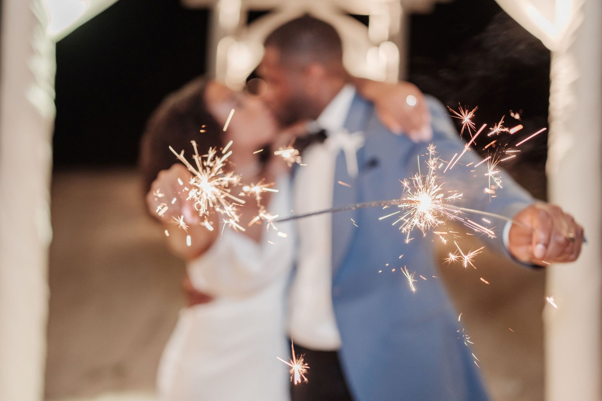couple kissing sparkler send off wedding night Caribbean Sandals
