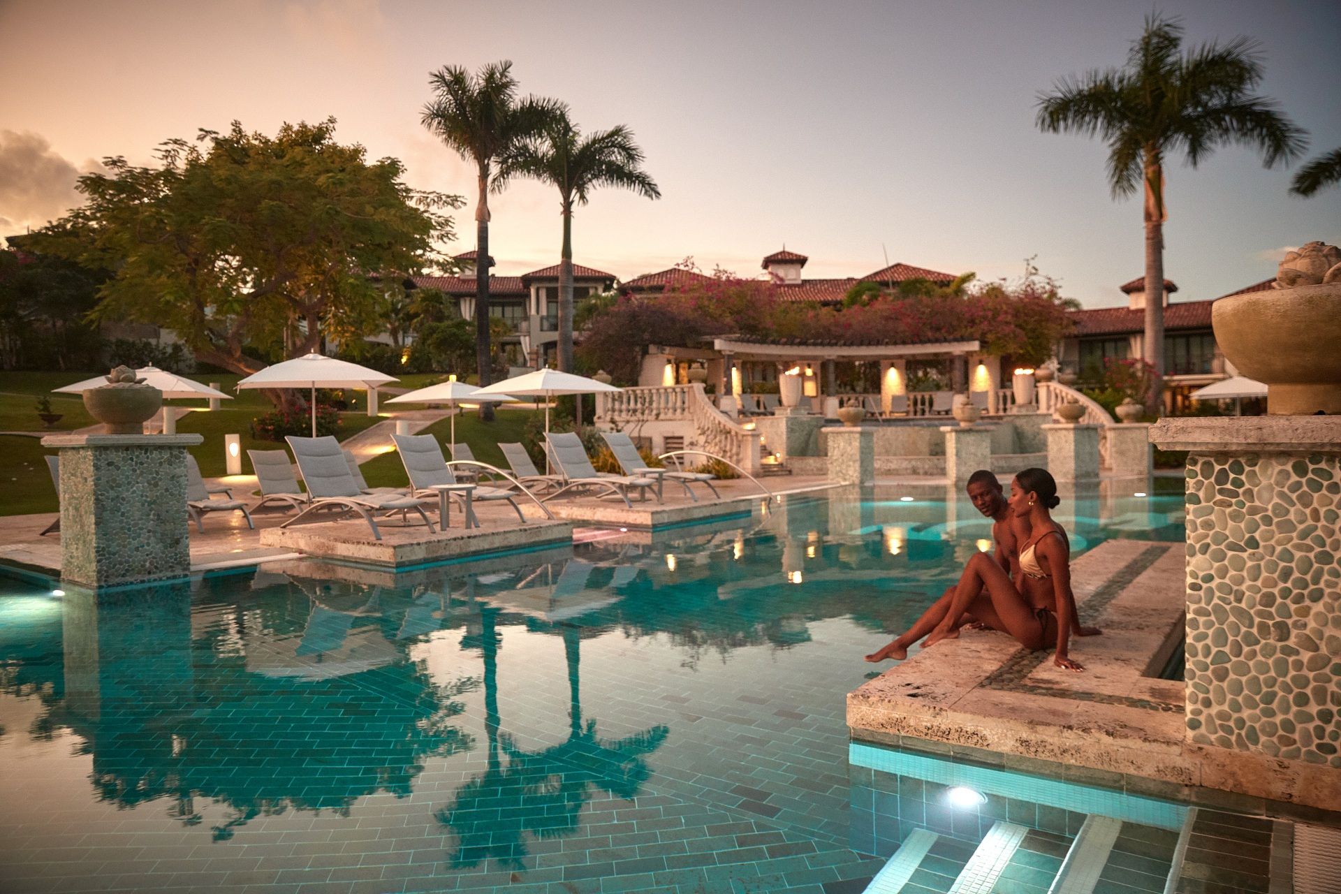 SLS-Lifestyle-Main-Pool-Couple-Pool-Edge
