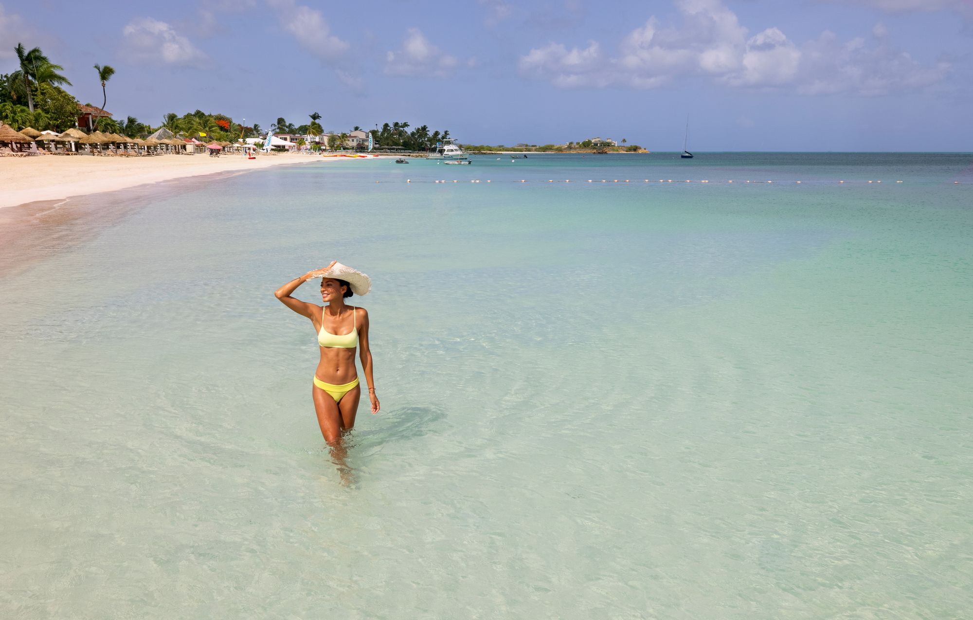 Sandals-vacation-woman-in-ocean-Antigua